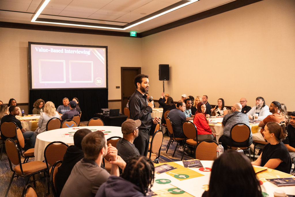 Speaker presenting a value-based interviewing session at the Bell Partners corporate conference day two