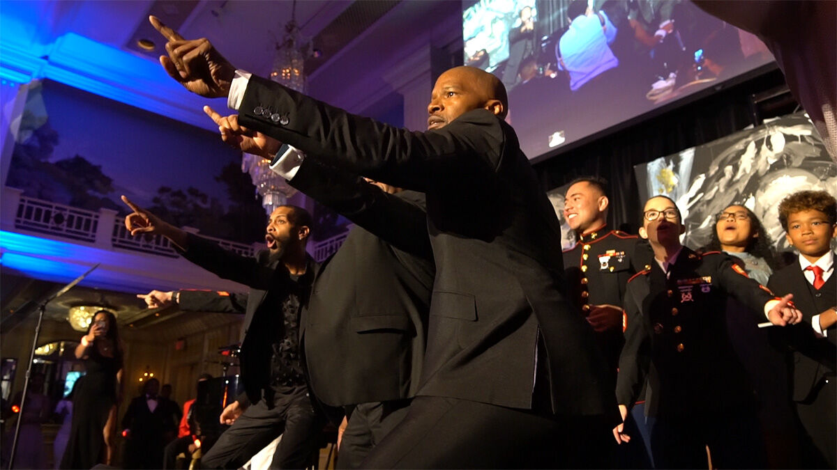 Energetic performers and military-uniformed guests dancing at a formal gala, K2 Productions event videography