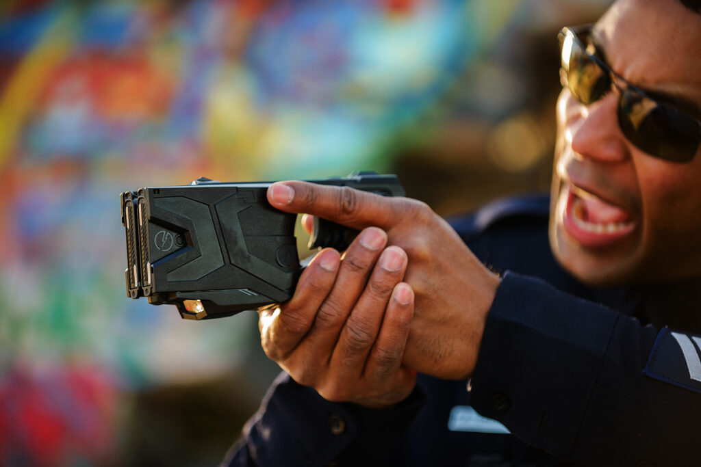 Police with Tazer K2 Product Photography