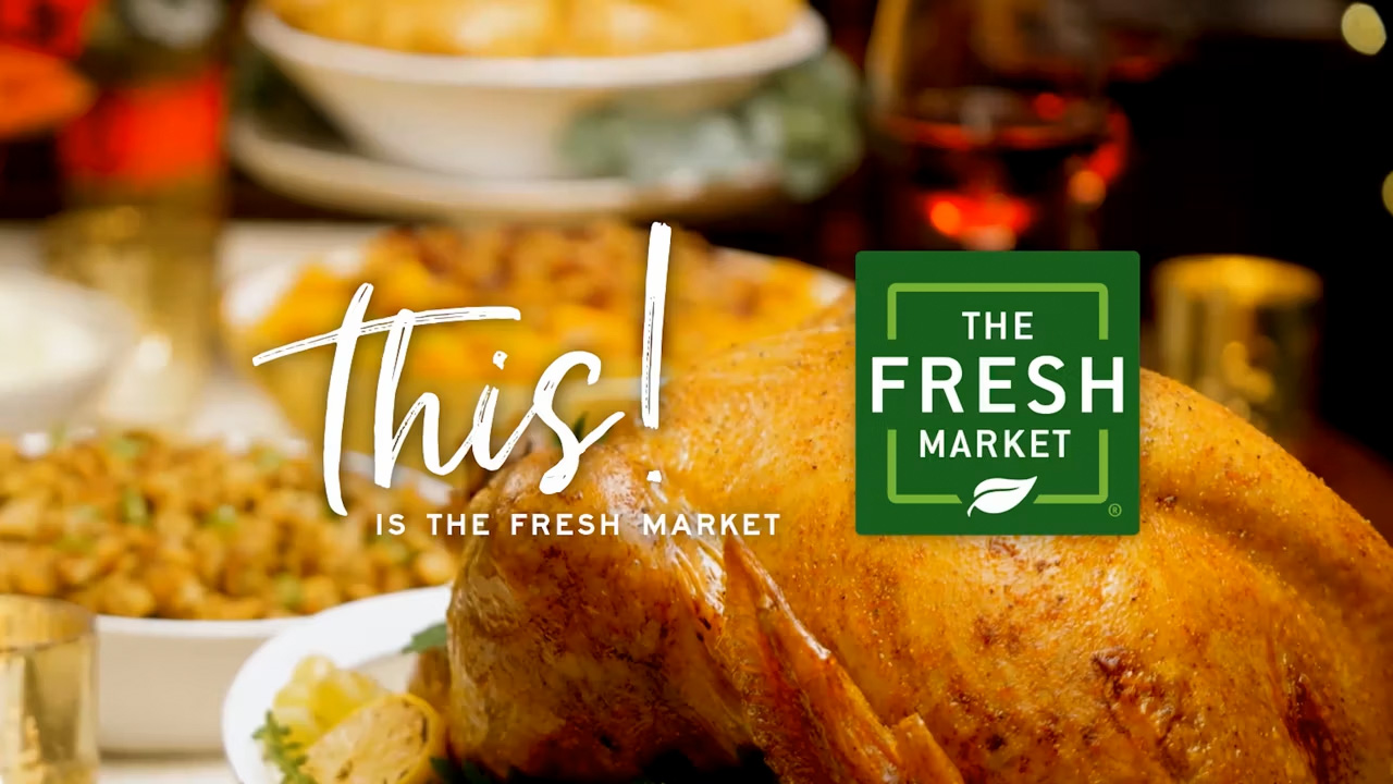 The Fresh Market logo with food in the background.