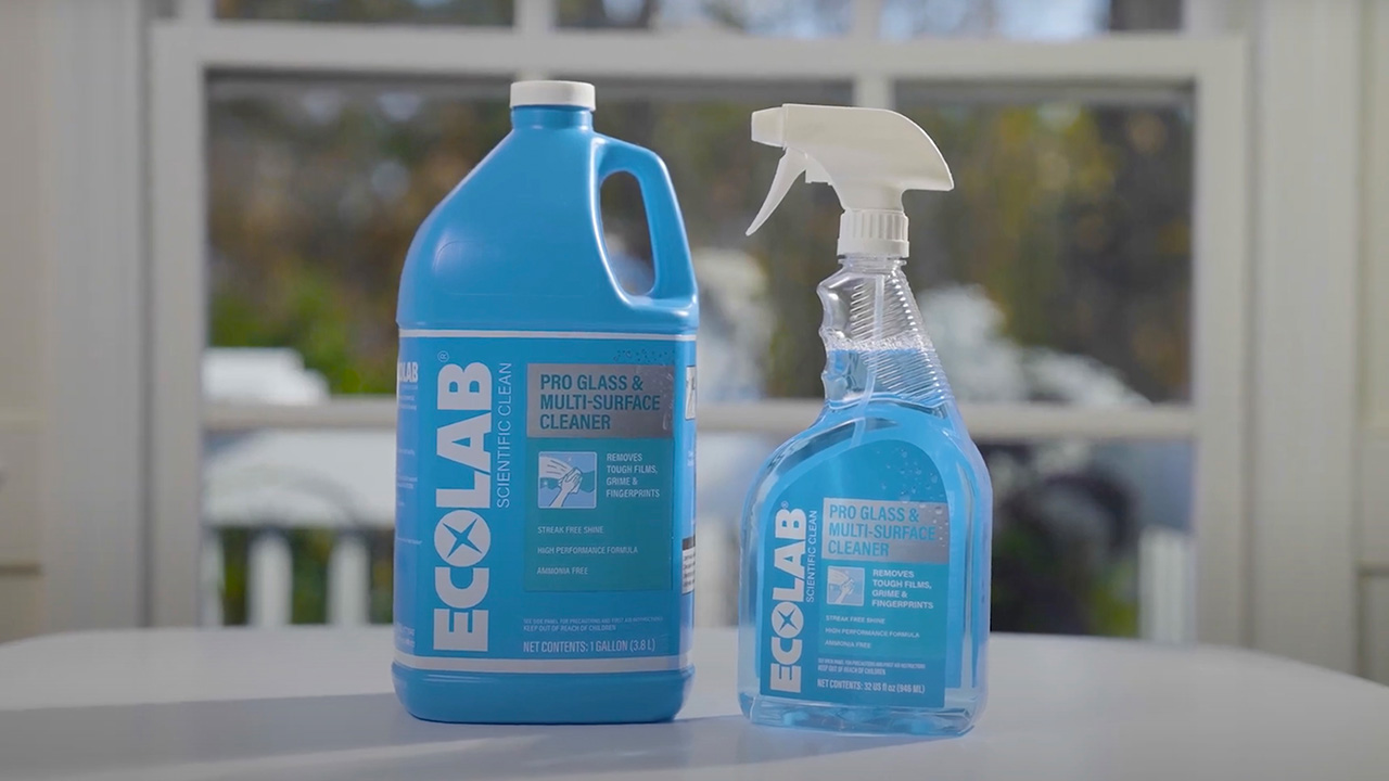 An Ecolab glass cleaner bottle and spray bottle for a glass cleaner product video.