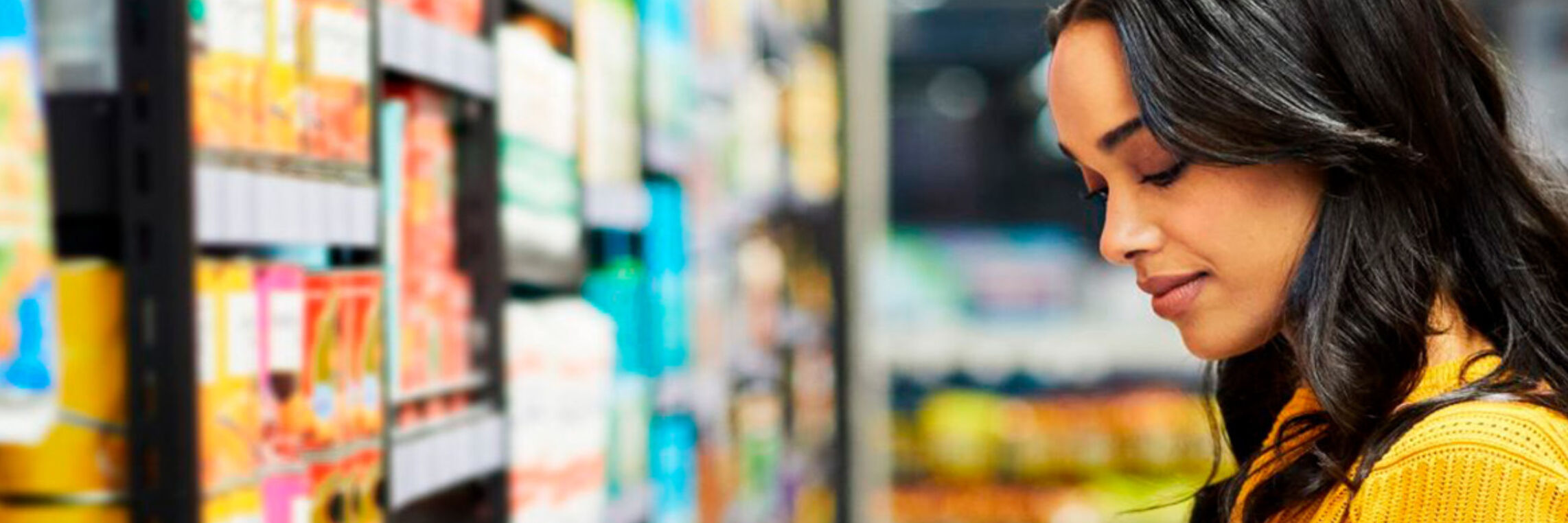 Woman browsing retail store aisle, retail video and photo production