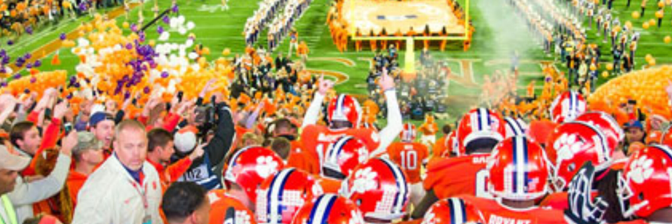 Clemson football team running onto the field, sports video and photo production
