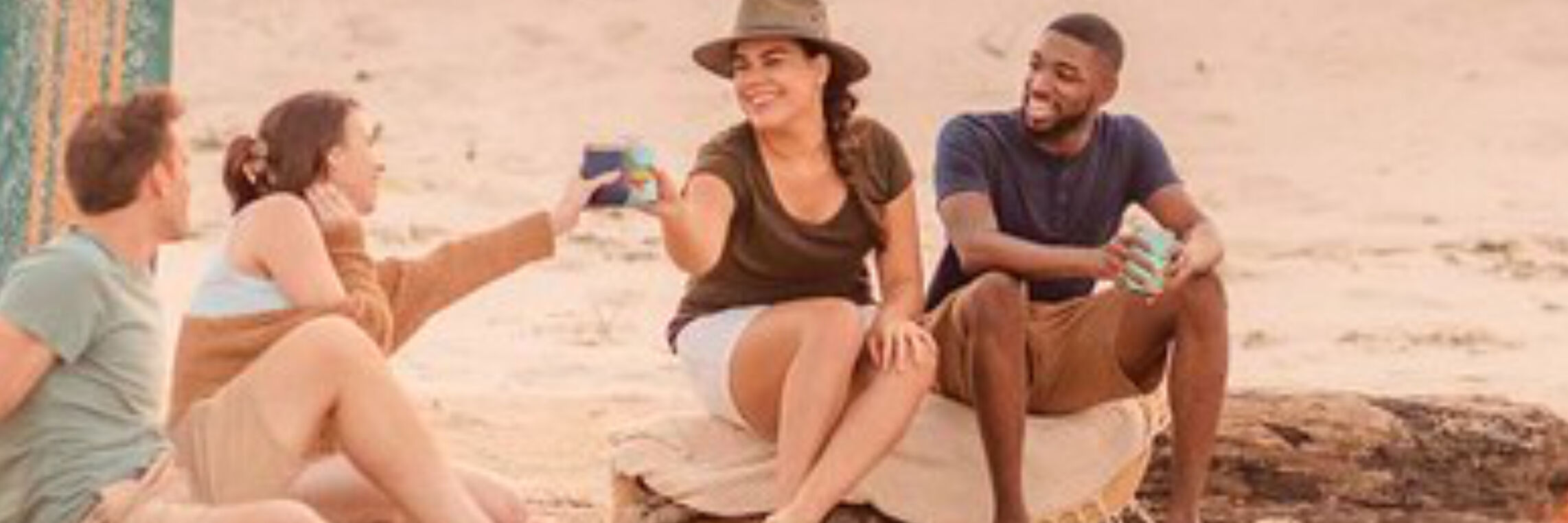 Group of people socializing on a beach, travel and hospitality video and photo production
