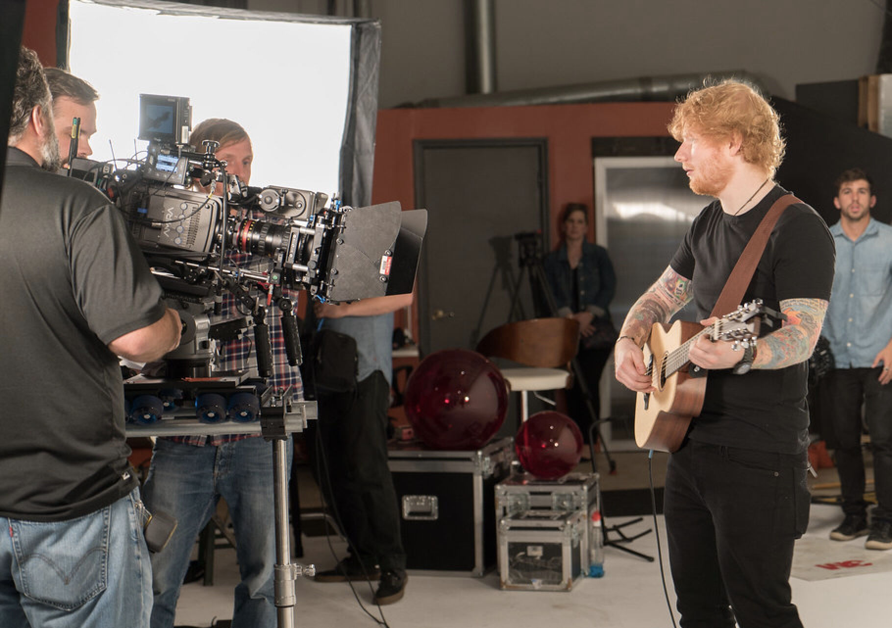 Ed Sheeran playing guitar on set during K2 Productions video production shoot