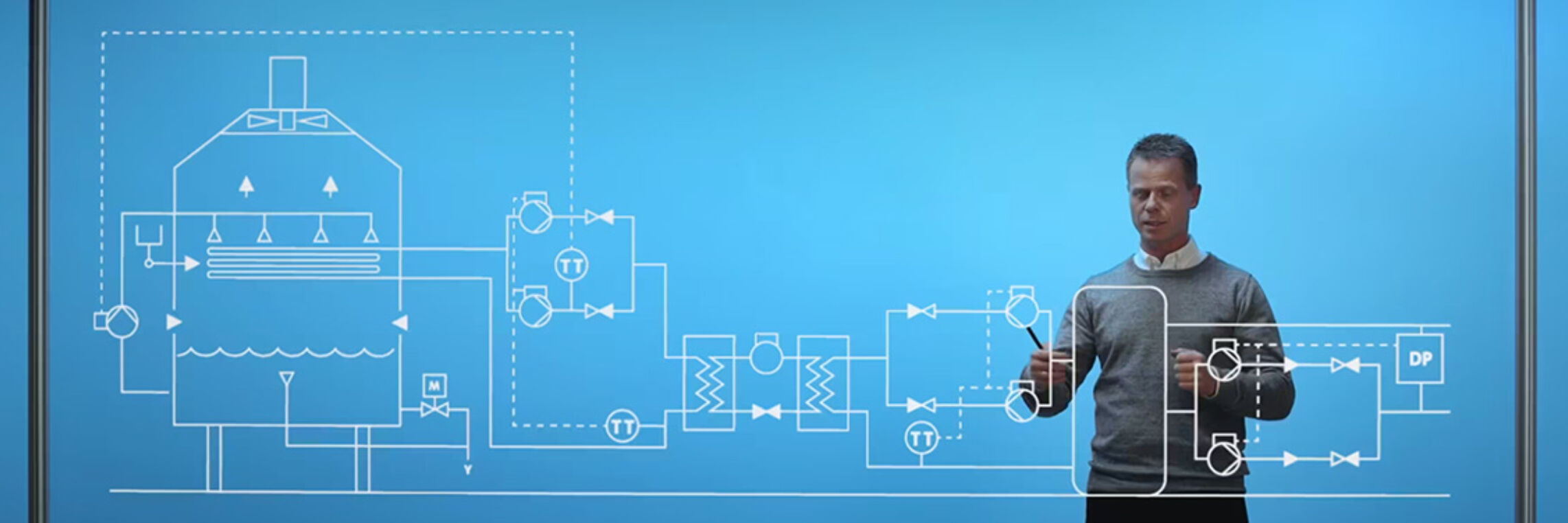 Man presenting at a virtual event with technical diagram on blue display