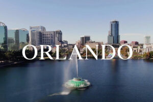 Aerial view of the Orlando skyline with lake and fountain, venue for Bell Leadership Conferences