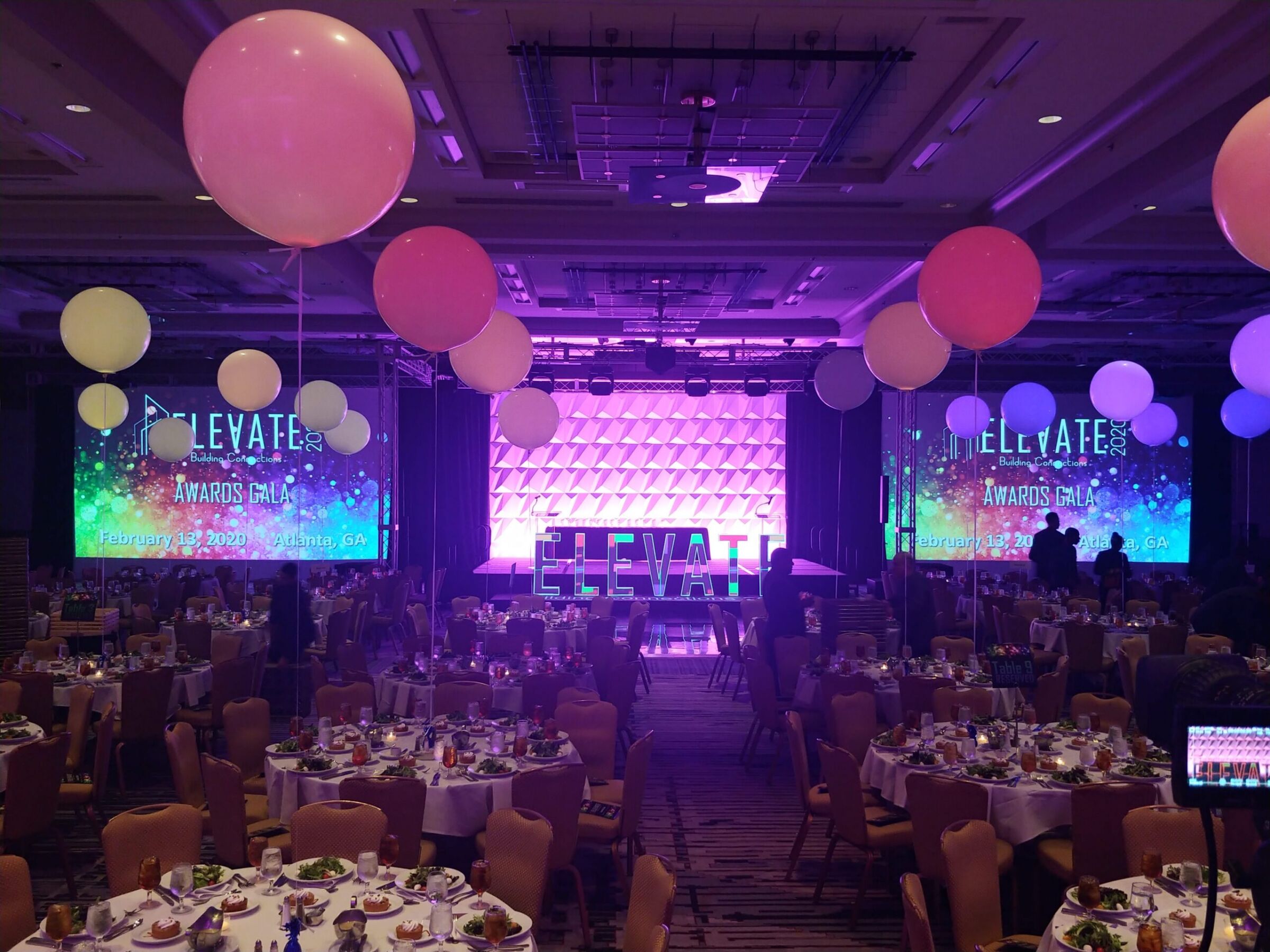 Elevate Building Connections Awards Gala ballroom setup with LED screens and oversized balloons, K2 Productions AV services